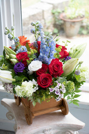 New Baby Flowers in a wooden carriage