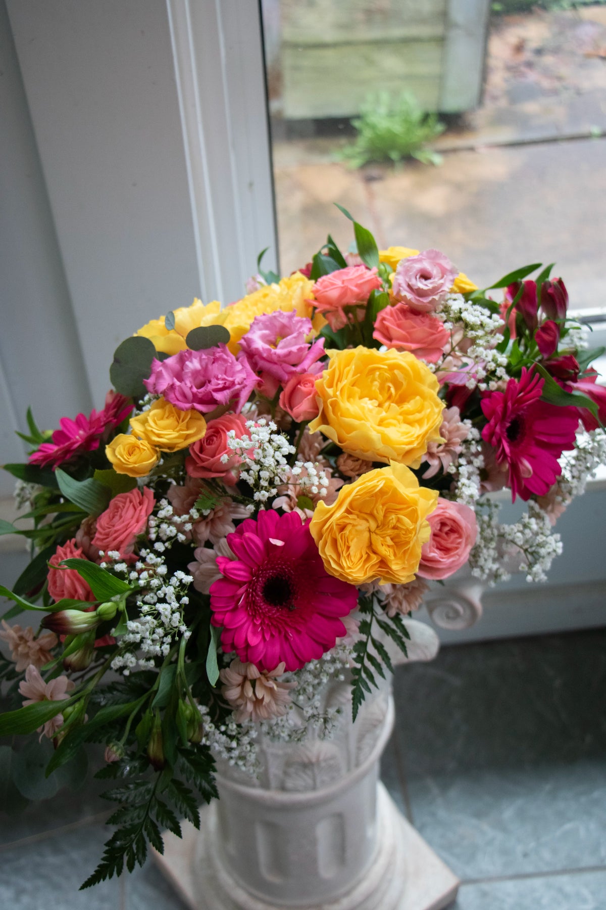 Dining table centrepiece of seasonal flowers