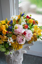 Dining table centrepiece of seasonal flowers