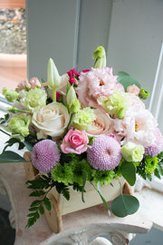 New Baby Flowers in a wooden carriage