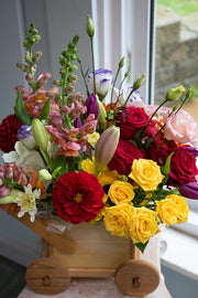 New Baby Flowers in a wooden carriage