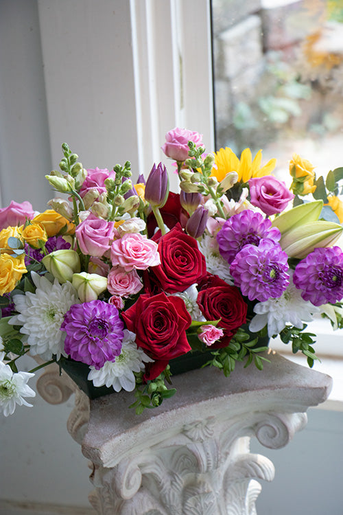 Dining table centrepiece of seasonal flowers