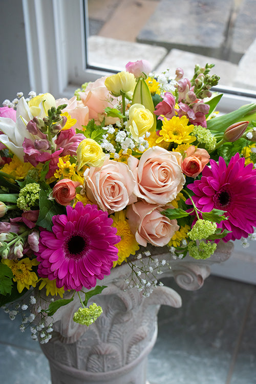 Dining table centrepiece of seasonal flowers