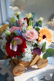 New Baby Flowers in a wooden carriage