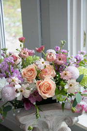 Dining table centrepiece of seasonal flowers